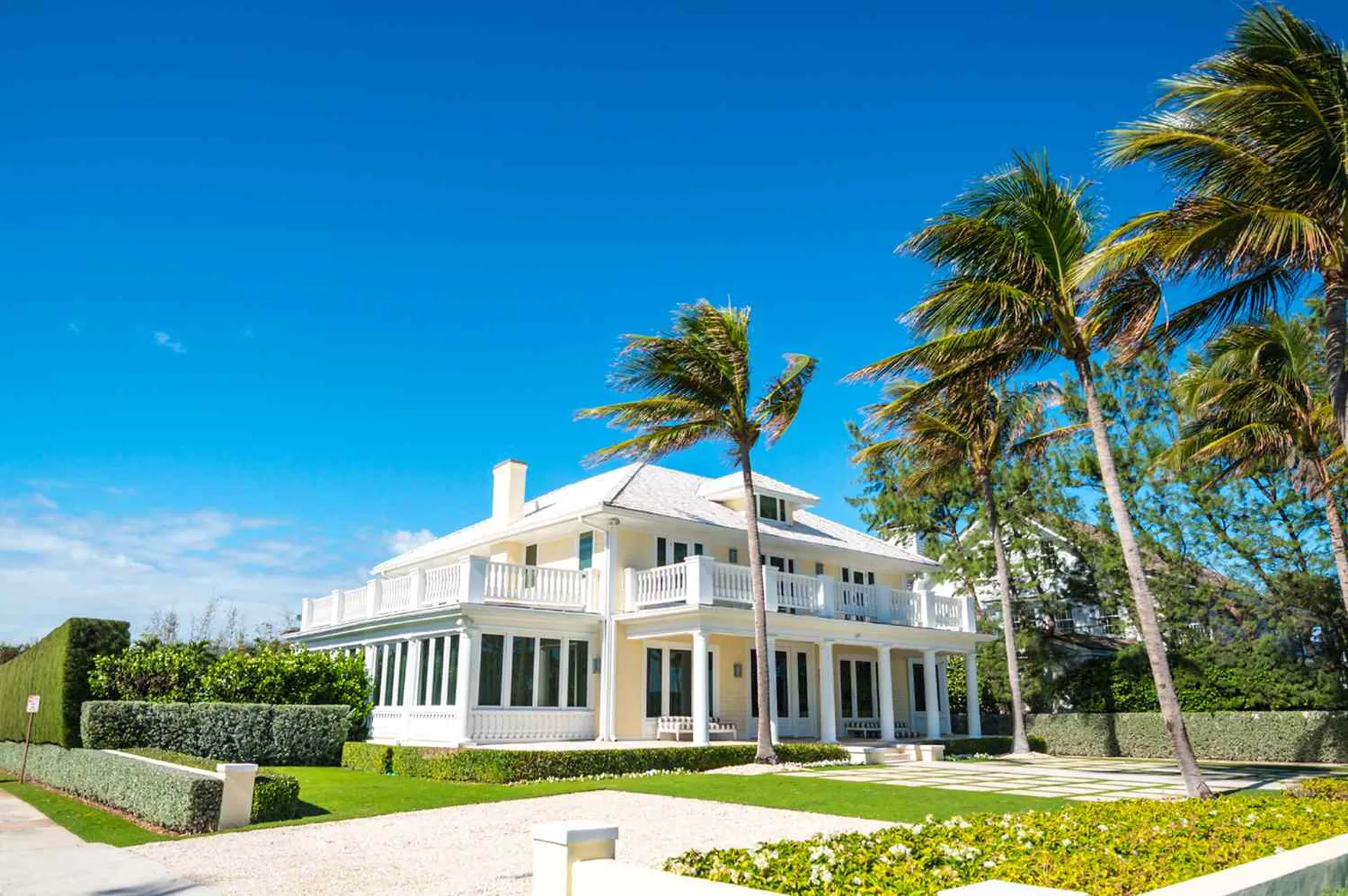 Classic South Florida home with palm trees in Palm Beach County